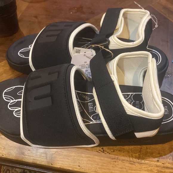 ADIDAS X HUMANRACE BY PHARRELL WILLIAMS Black Adilette 2.0 Sandals - Picture 2 of 9